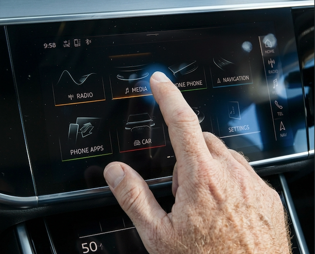 Basic factory Audi infotainment screen — Radio, Media, Navigation tiles on a premium car